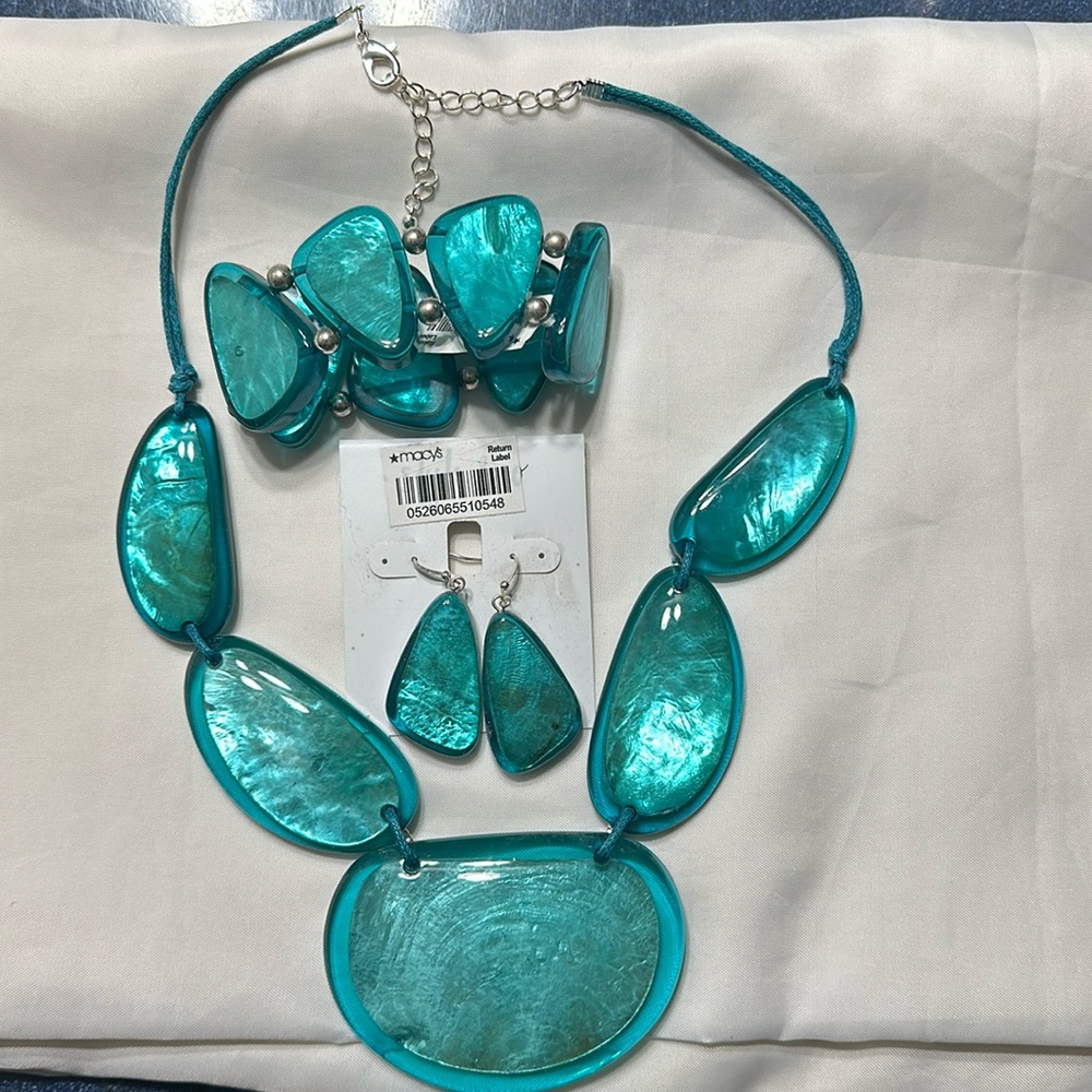 3 piece jewelry set , necklace , bracelet and pieced earrings. Dark teal color